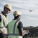 Surveyors in the field performing a mapping mission using a md4-1000 UAV