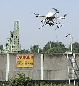 Surveying specialists inspecting a dilapidated damn with a Microdrones md4-1000 UAV