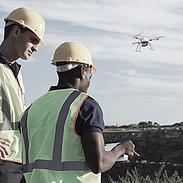 Surveyors in the field performing a mapping mission using a md4-1000 UAV