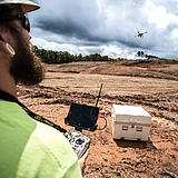 Surveying specialist using a Microdrones md4-3000 mdLiDAR3000 to perform a Laser scan of a construction site