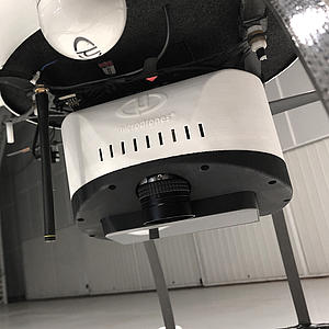 Close-up Microdrones md4-1000 mdLiDAR1000 Laser scanner in a big airplane hangar